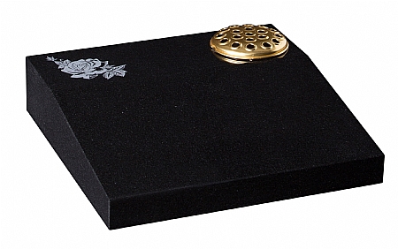 A cremation desk featuring a rose ornament
